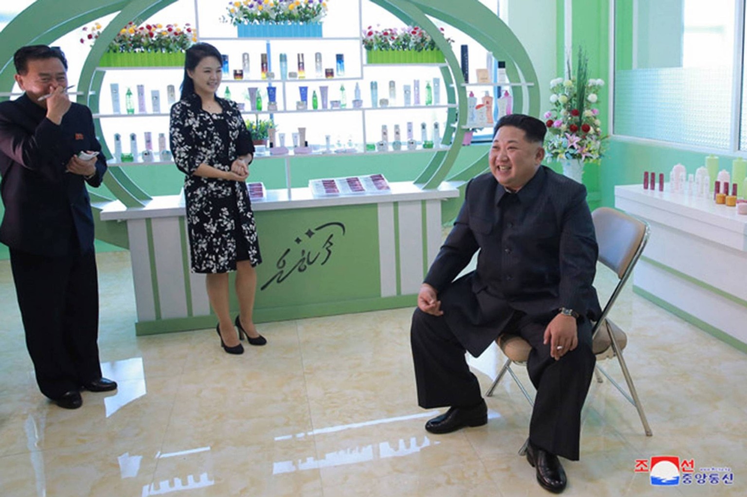 This image released on October 29, 2017, by the North Korean Official News Service (KCNA), shows North Korean leader Kim Jong Un and his wife, Ri Sol Ju, visiting a cosmetics factory in Pyongyang. Dur ...