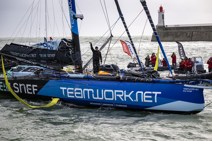 Skipper Justine Mettraux of Switzerland reacts as she passes through the channel aboard her IMOCA Teamwork-Team Snef after crossing the finish line during the Vendee Globe round-the-world solo sailing ...