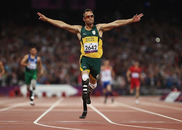 LONDON, ENGLAND - SEPTEMBER 08: Oscar Pistorius of South Africa celebrates as he wins gold in the Men&#039;s 400m T44 Final on day 10 of the London 2012 Paralympic Games at Olympic Stadium on Septembe ...