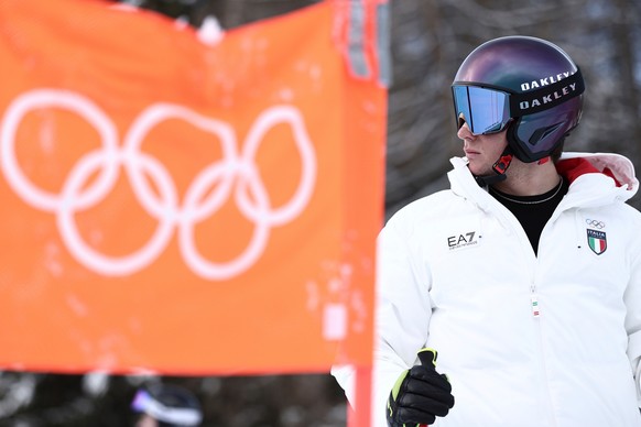 Italy's Giovanni Franzoni concentrates ahead of an alpine ski, men's downhill official training, at the 2026 Winter Olympics, in Bormio, Italy, Thursday, Feb. 5, 2026. (AP Photo/Gabriele Fac ...