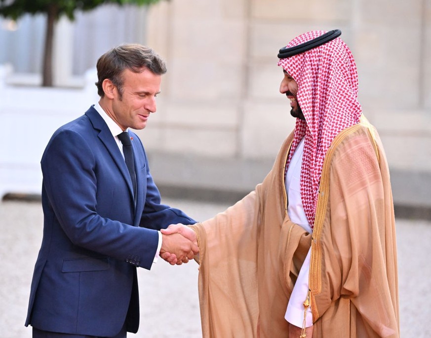 PARIS, FRANCE - JULY 28: French President Emmanuel Macron (L) welcomes Saudi Arabian Crown Prince Mohammed bin Salman Al Saud (R) at presidential Elysee Palace in Paris France on July 28, 2022. (Photo ...