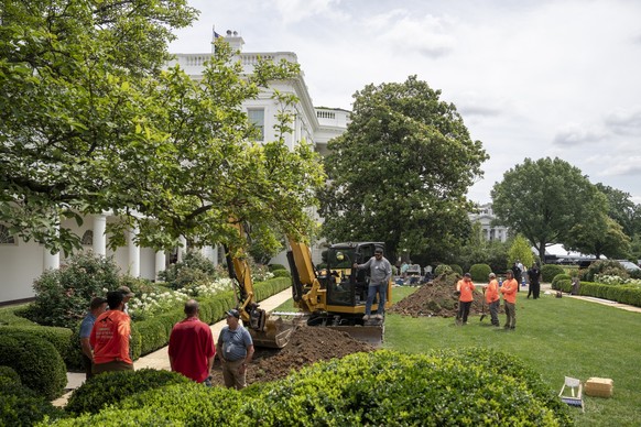 A crew works in the Rose Garden of the White House for Trump�s projects to pave over the Rose Garden grass area at the White House in Washington, DC., on Tuesday, June 10, 2025. Photo by Ken Cedeno/Po ...