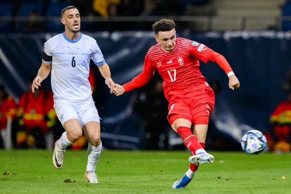 Israel&#039;s midfielder Neta Lavi, left, fights for the ball with Switzerland&#039;s midfielder Ruben Vargas, right, during the UEFA Euro 2024 qualifying group I soccer match between Israel and Switz ...