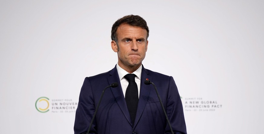 epa10707879 French President Emmanuel Macron reacts during a joint press conference at the end of the New Global Financial Pact Summit, Paris, France, 23 June 2023. The two-day summit aimed at seeking ...
