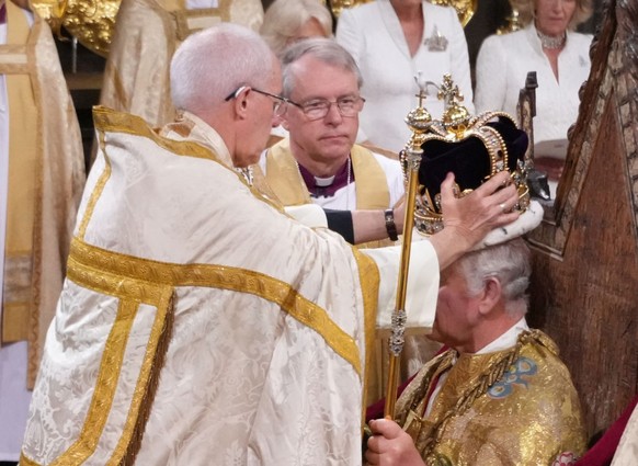LONDON, ENGLAND - MAY 06: King Charles III is crowned with St Edward&#039;s Crown by The Archbishop of Canterbury the Most Reverend Justin Welby during his coronation ceremony in Westminster Abbey, on ...