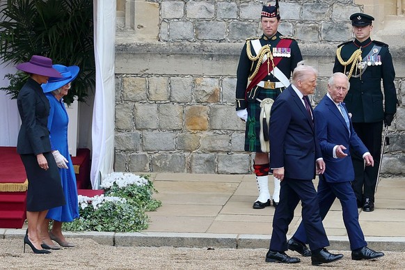 WINDSOR, ENGLAND - SEPTEMBER 17: First Lady Melania Trump, Queen Camilla, U.S. President Donald Trump, King Charles III inspect the troops during the State visit by the President of the United States  ...