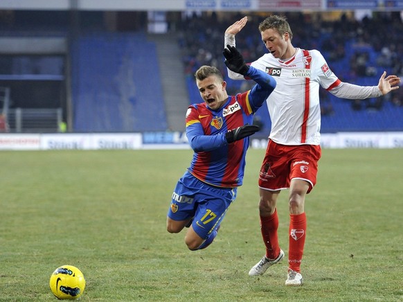 Basel&#039;s Xherdan Shaqiri, left, fights for the ball against Sion&#039;s Arnaud Buehler, right, during the Super League soccer match between FC Basel and FC Sion at the St. Jakob-Park stadium in Ba ...