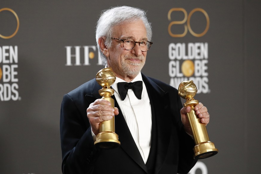 epa10399367 US director Steven Spielberg poses with the awards for Best Director of a Motion Picture and Best Motion Picture ? Drama in the press room during the 80th annual Golden Globe Awards ceremo ...