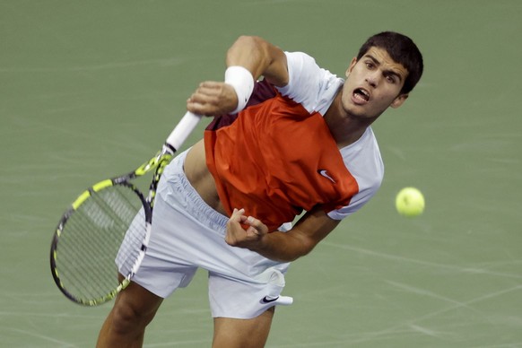 Carlos Alcaraz, of Spain, serves to Marin Cilic, of Croatia, during the fourth round of the U.S. Open tennis championships, early Tuesday, Sept. 6, 2022, in New York. (AP Photo/Adam Hunger)