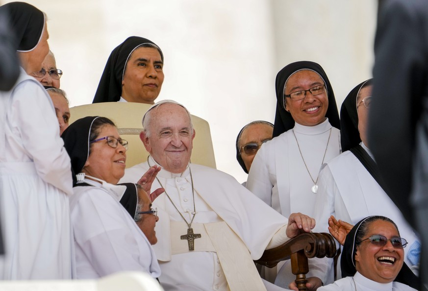 FILE - Pope Francis poses for a photo with nuns at the end of his weekly general audience in St. Peter&#039;s Square at the Vatican, Wednesday, June 22, 2022. On Wednesday, July 13, 2022, Pope Francis ...