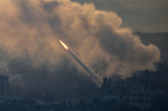 epa10904964 A rocket is launched from the coastal Gaza strip towards Israel by militants of the Ezz Al-Din Al Qassam militia, the military wing of Hamas movement, in Gaza City, 07 October 2023. Rocket ...
