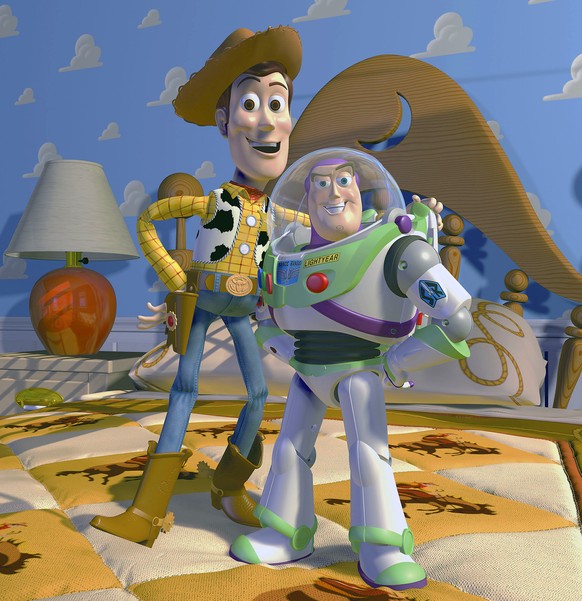This film publicity image released by Disney Pixar shows characters Woody, left, and Buzz Lightyear, from the animated film &amp;quot;Toy Story.&amp;quot; Disney Pixar announced Thursday, Nov. 6, 2014 ...