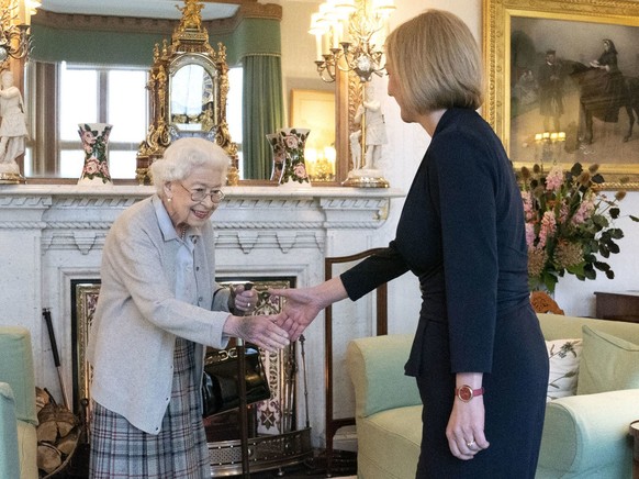 Britain's Queen Elizabeth II, left, welcomes Liz Truss during an audience at Balmoral, Scotland, where she invited the newly elected leader of the Conservative party to become Prime Minister and ...