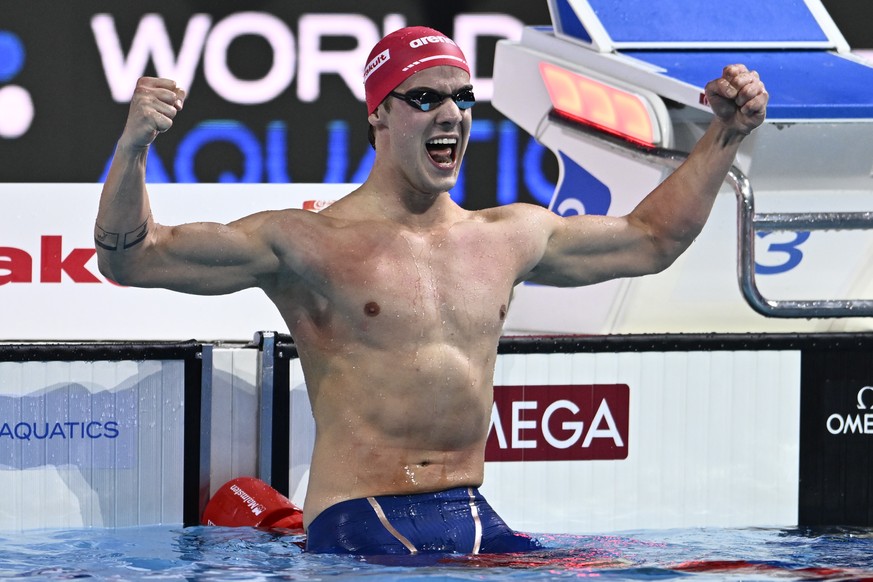 Switzerland&#039;s Noe Ponti reacts after winning and setting the world record in the 100-meter butterfly final at the World Short Course Swimming Championships in Budapest, Hungary, Saturday, Dec. 14 ...