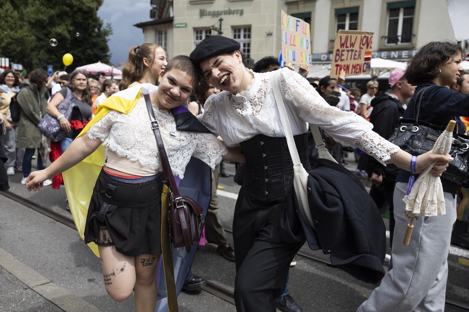 A couple poses during a pride parade in Bern, Switzerland, Saturday, August 2, 2025. (KEYSTONE/Peter Klaunzer)
