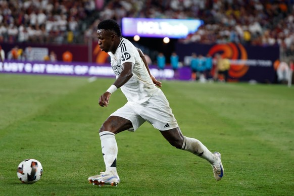 epa11523870 Vinicius Junior of Real Madrid CF in action during the Champions Tour Live soccer match between Real Madrid CF and FC Barcelona in East Rutherford, New Jersey, USA, 03 August 2024. EPA/KEN ...