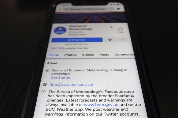 A disclaimer is shown on the bottom of Australia&#039;s Bureau of Meteorology page on the Facebook app Thursday, Feb. 18, 2021, in Tokyo. Australia&#039;s government has condemned Facebook over its sh ...