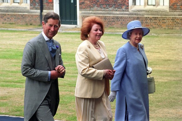 The Queen and the Prince of Wales accompanied by Lady Elizabeth Anson at a wedding reception in Hampton Court Palace for the exiled Crown Prince Pavlos of Greece and Marie-Chantal Miller (Photo by Sea ...