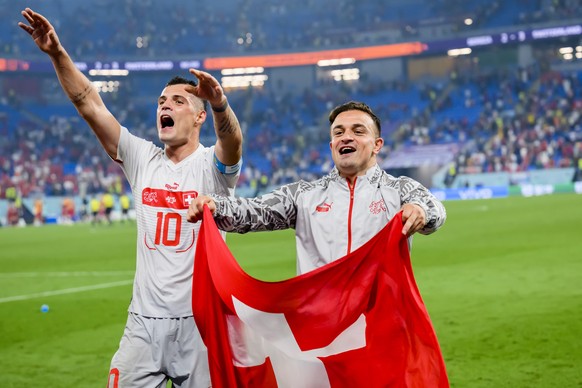 Switzerland&#039;s midfielder Granit Xhaka and Switzerland&#039;s midfielder Xherdan Shaqiri celebrate the victory and the qualification during the FIFA World Cup Qatar 2022 group G soccer match betwe ...
