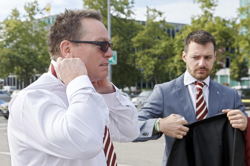 Geneve-Servette&#039;s General Manager Chris McSorley, left, next to Arnaud Cogne, right, Media Manager of Geneve-Servette HC, adjusts his tie, during the photo session of Swiss ice hockey club Geneve ...