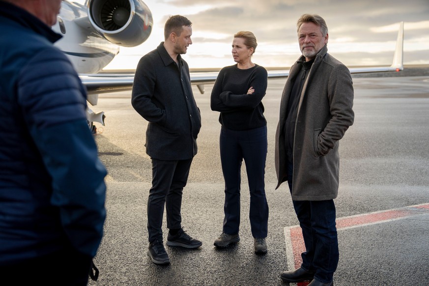 Chairman of the Naalakkersuisut Jens-Frederik Nielsen, centre left, welcomes Danish Prime Minister Mette Frederiksen, centre right, and her husband, Bo Tengberg, right, as they land at Nuuk airport in ...