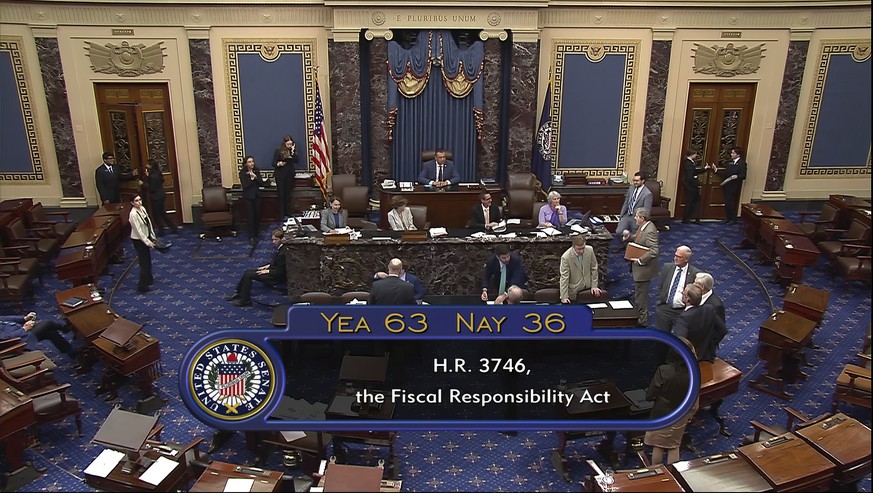 In this image from Senate Television, the final vote of 63-36 shows passage of the bill to raise the debt ceiling Thursday night, June 1, 2023, in the Senate at the Capitol in Washington. President Jo ...