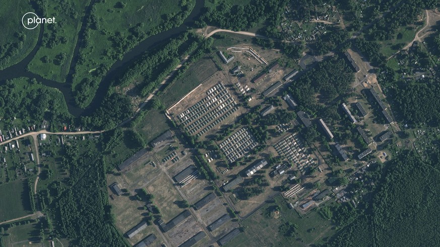 This satellite image provided by Planet Labs PBC and taken on Friday, June 30, 2023, shows apparent recent construction of tents at a former military base outside the Belarusian town of Osipovichi. As ...