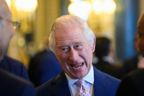 LONDON, ENGLAND - MAY 05: King Charles III reacts as he attends a Realm Governors General and Prime Ministers Lunch, ahead of the coronation of King Charles III, at Buckingham Palace on May 5, 2023 in ...
