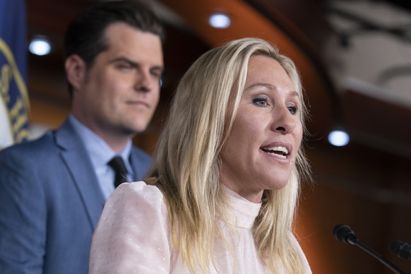 FILE - Rep. Marjorie Taylor Greene, R-Ga., joined at left by Rep. Matt Gaetz, R-Fla., speaks at a news conference about the treatment of people being held in the District of Columbia jail who are char ...