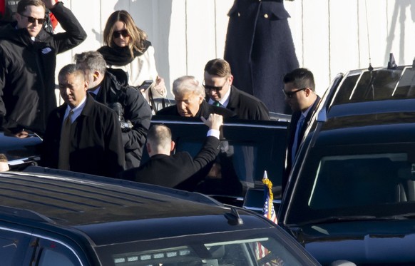 U.S. President Donald Trump walks out of the Marine One helicopter and enters his armored limousine upon arrival for the 56th annual meeting of the World Economic Forum. WEF, in Davos, Switzerland, on ...