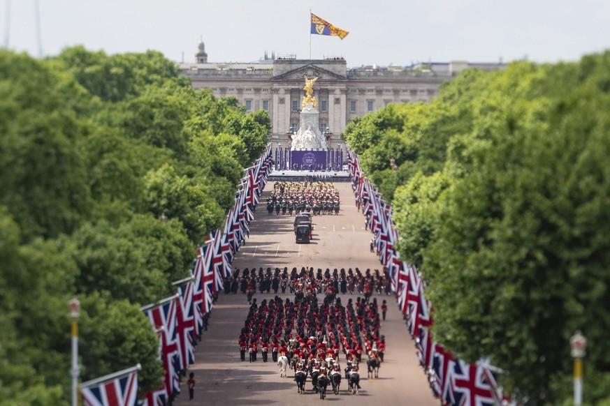 Troops march on The Mall leading to Buckingham Palace during the Trooping the Color ceremony in London, Thursday June 2, 2022, on the first of four days of celebrations to mark the Platinum Jubilee.