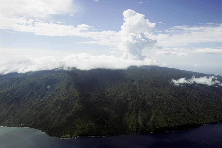 FILE - Steam billows from Lake Vui in the volcano crater of Mount Manaro on the island of Ambae, part of the Vanuatu islands chain, Dec. 8, 2005. A 7.7 magnitude earthquake Friday, May 19, 2023, in th ...