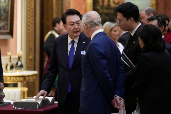 LONDON, ENGLAND - NOVEMBER 21: King Charles III with Queen Camilla shows The President of Korea Yoon Suk Yeol and First Lady, Kim Keon Hee a display of Korean items from the Royal Collection, inside B ...