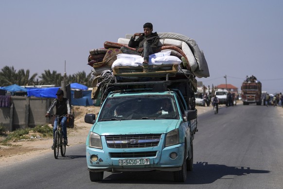 FILE - Displaced Palestinians arrive in central Gaza after fleeing from the southern Gaza city of Rafah in Deir al Balah, Gaza Strip, on Thursday, May 9, 2024. Palestinians on Wednesday, May 15, 2024, ...