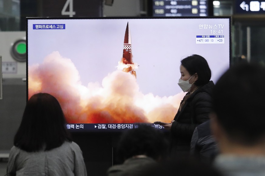 People watch a TV showing an image of North Korea&#039;s new guided missile during a news program at the Suseo Railway Station in Seoul, South Korea, Friday. March 26, 2021. In resuming its ballistic  ...