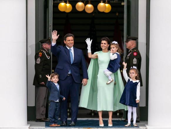 From left to right: Mason, Florida Gov. Ron DeSantis, Casey DeSantis, Mamie and Madison wave to the crowd during the inauguration ceremony at the historic Florida Capitol on Jan. 3, 2023, in Tallahass ...