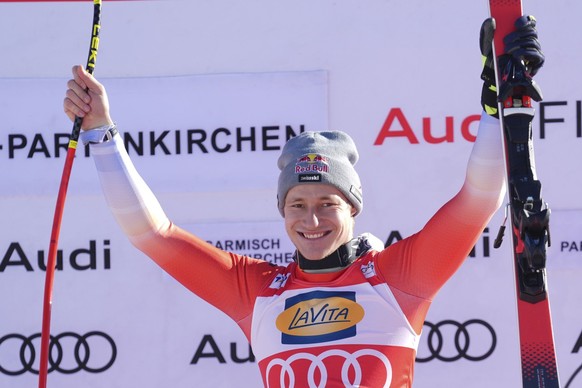 The winner Switzerland&#039;s Marco Odermatt celebrates after an alpine ski, men&#039;s World Cup super G race, in Garmisch-Partenkirchen, Germany, Sunday, Jan. 28, 2024. (AP Photo/Giovanni Auletta)
