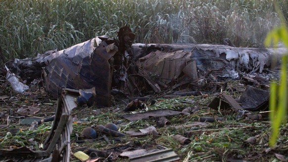 epa10075681 The wreckage of an Antonov An-12 aircraft that crashed near Antiphilippi, Kavala, northern Greece, 17 July 2022. The cargo plane crashed on the night of 16 July with eight crew members onb ...