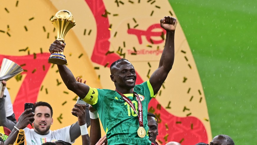 epa12660131 Sadio Mane of Senegal celebrates holding the trophy after winning the CAF Africa Cup of Nations after the final match between Senegal and Morocco in Rabat, Morocco, 18 January 2026. EPA/JA ...
