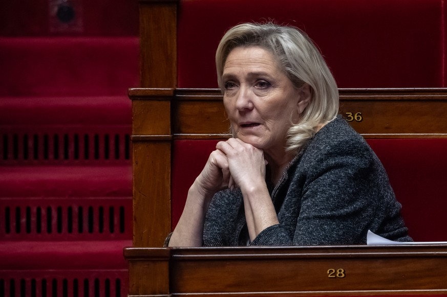 epa12567007 Leader of the National Rally (Rassemblement National, RN) parliamentary group Marine Le Pen attends a session of questions to the government at the French National Assembly in Paris, Franc ...