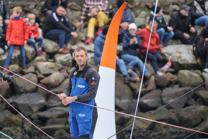LES SABLES-D&#039;OLONNE, FRANCE - NOVEMBER 10: Thomas Ruyant of France sailing Vulnerable furled the mainsail during the Vendee Globe 2024 Race Starting Day at Port des Sables-d&#039;Olonne on Novemb ...