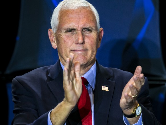 Former Vice President Mike Pence claps during the Young America&#039;s Foundation event, &quot;How to Save America from the Woke Left,&quot; Monday, Nov. 1, 2021, at the Iowa Memorial Union on the Uni ...