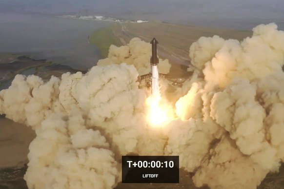 epa10581851 A frame grab from a handout livestream video released by SpaceX showing the launch of inaugural test flight of Starship on the second attempt at the SpaceX launch facility in Boca Chica, T ...