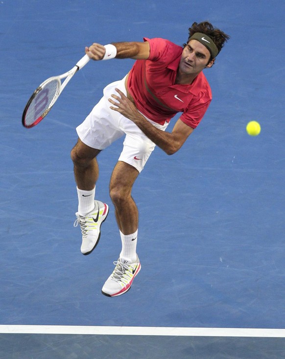 Roger Federer of Switzerland serves to Rafael Nadal of Spain during their semifinal at the Australian Open tennis championship, in Melbourne, Australia, Thursday, Jan. 26, 2012. (AP Photo/John Donegan ...