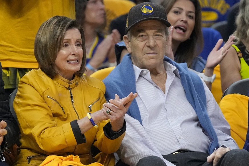 FILE - Rep. Nancy Pelosi, D-Calif., left, and her husband, Paul, watch during Game 4 in the first round of the NBA basketball playoffs between the Golden State Warriors and the Sacramento Kings in San ...
