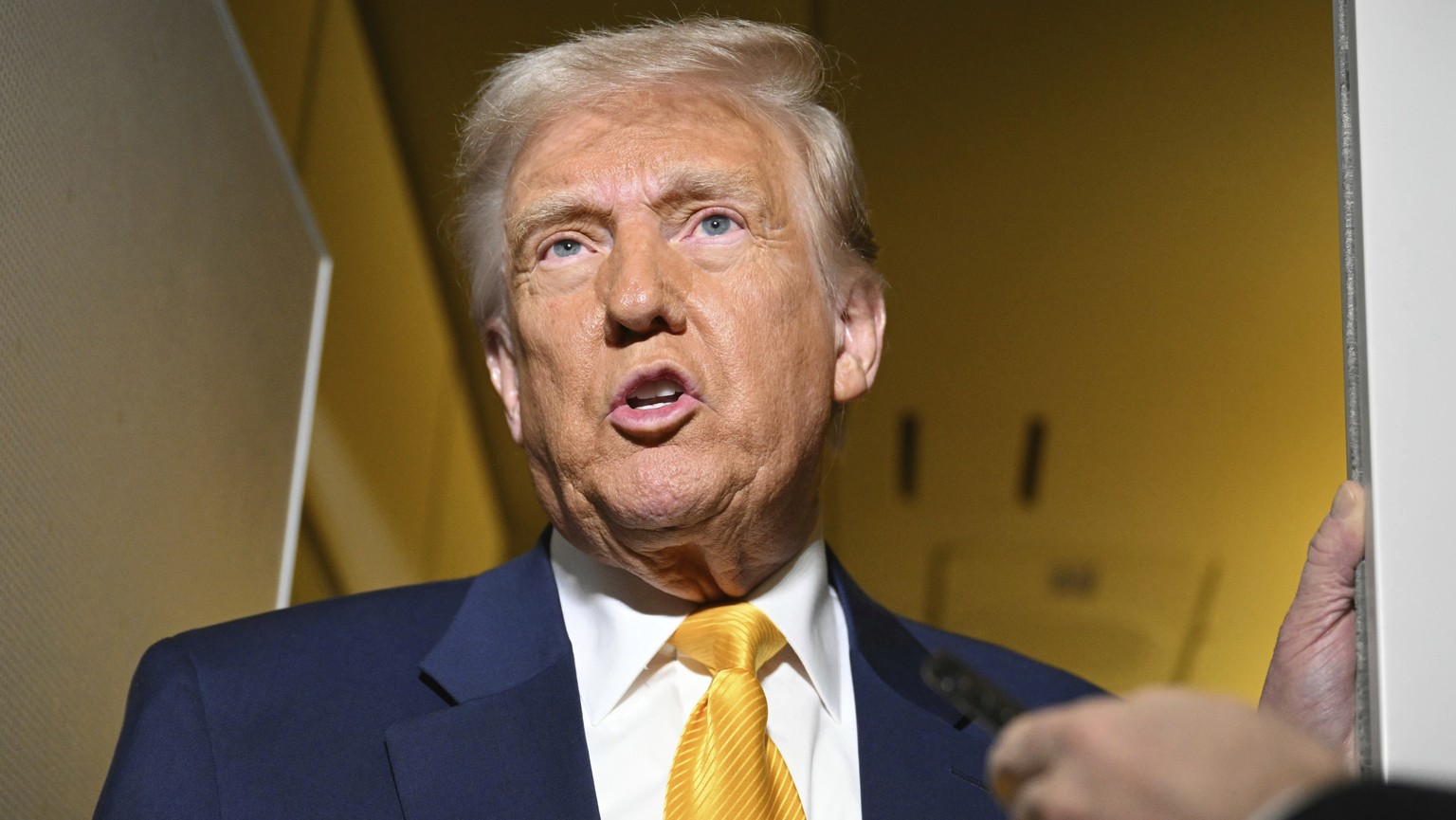 President Donald Trump speaks to the reporters on board Air Force One on the way to Miami, Saturday, April 12, 2025. (Pool via AP)
Trump