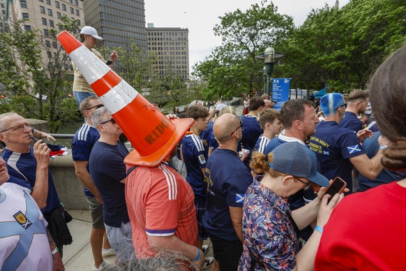 epa13048256 Aiden McBryan of Glasgow wears a traffic cone during the Tartan Army Downtown March in Providence, Rhode Island, USA, 18 June 2026. Scotland takes on Morocco in a Group C match 19 June at  ...
