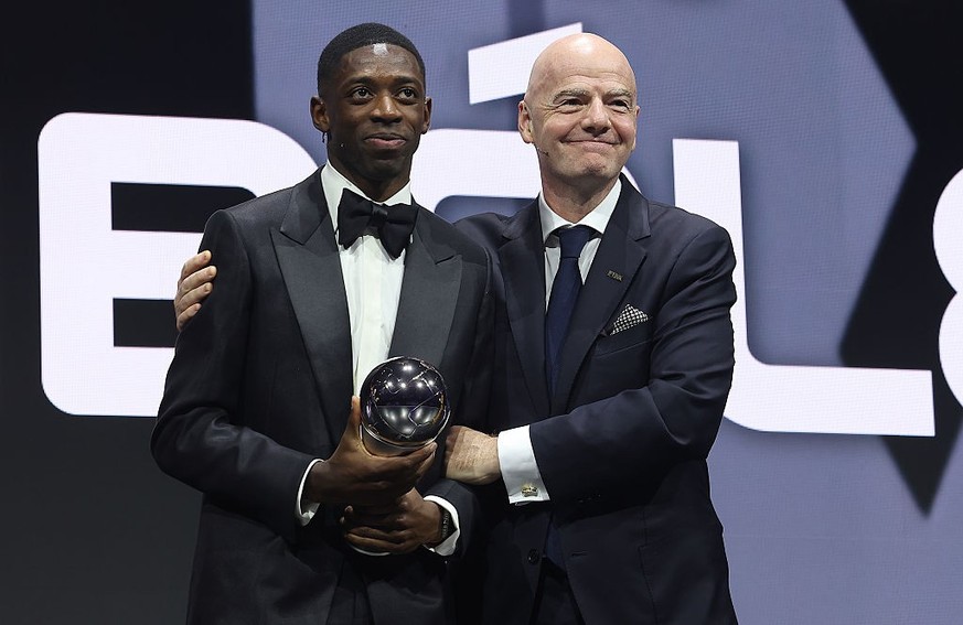 DOHA, QATAR - DECEMBER 16: The Best Fifa Men's Player winner, Ousmane Dembele on stage with Gianni Infantino, President of FIFA during The Best FIFA Football Awards 2025 at the Fairmont Katara Ha ...