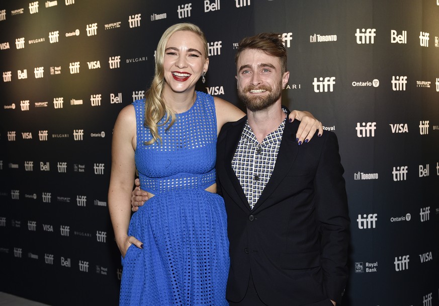 Daniel Radcliffe, right, and girlfriend Erin Darke attend the premiere for &quot;Weird: The Al Yankovic Story&quot; on day one of the Toronto International Film Festival at the Royal Alexandra Theatre ...