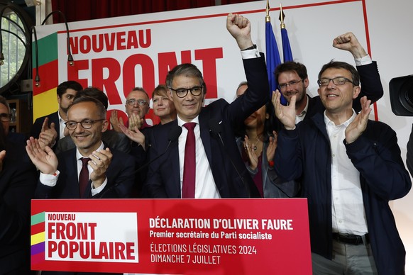 Olivier Faure, First Secretary of the Socialist Party, clenches his fist after the second round of the legislative elections, Sunday, July 7, 2024 at the party election night headquarters in Paris. A  ...